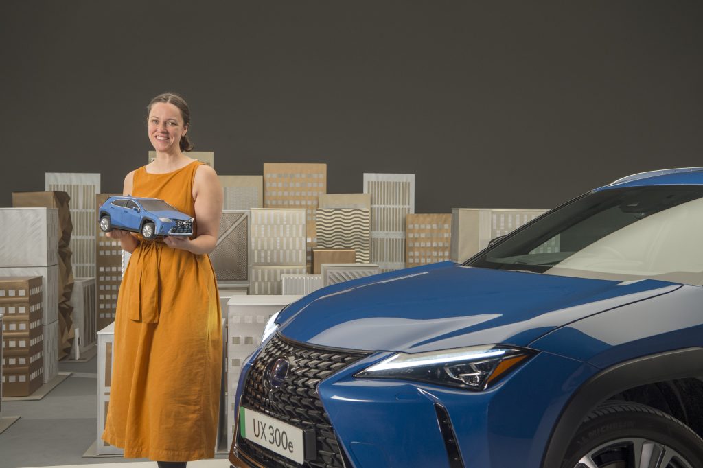 Kyla McCallum with her Lexus UX 300e paper car and full size car