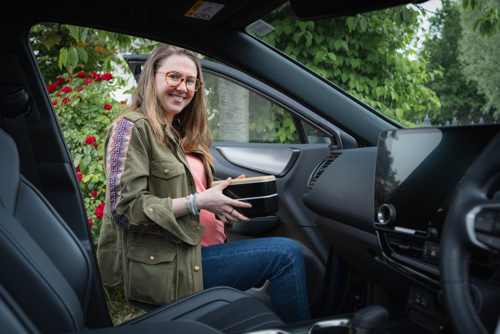 Emily Roux getting into the Lexus NX 450h+ plug in hybrid with her packed lunch