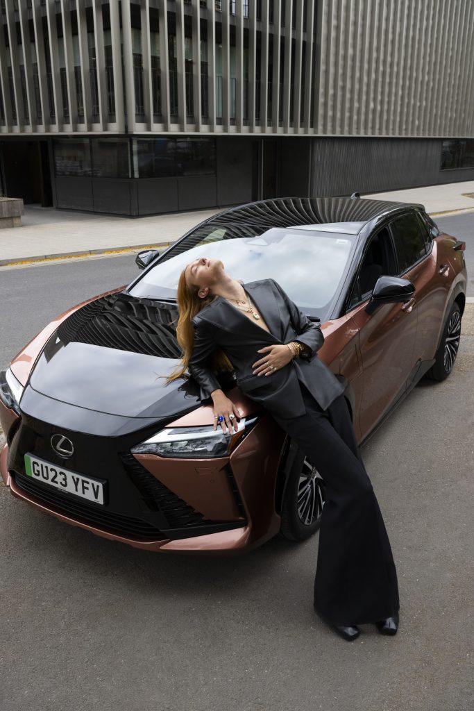 Harris Reed with the all-new Lexus RZ battery electric SUV on the way to his London Fashion show. Credits: Jason Lloyd - Evans.