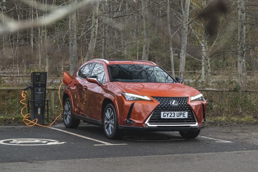 Lexus UX 300e all-electric SUV being re-charged at RHS Garden Wisley, Surrey.