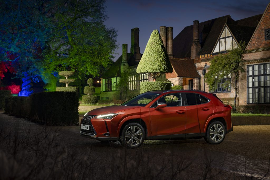 Lexus UX 300e all-electric SUV at GLOW light display at RHS Garden Wisley, in Surrey.