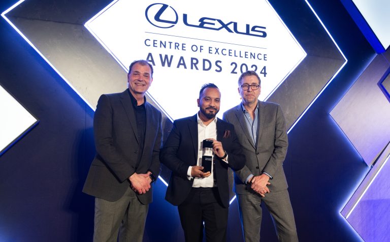 Chris Hayes Lexus Director (left) presents the award to Yousif Miah (centre) with Mark Chapman (host)