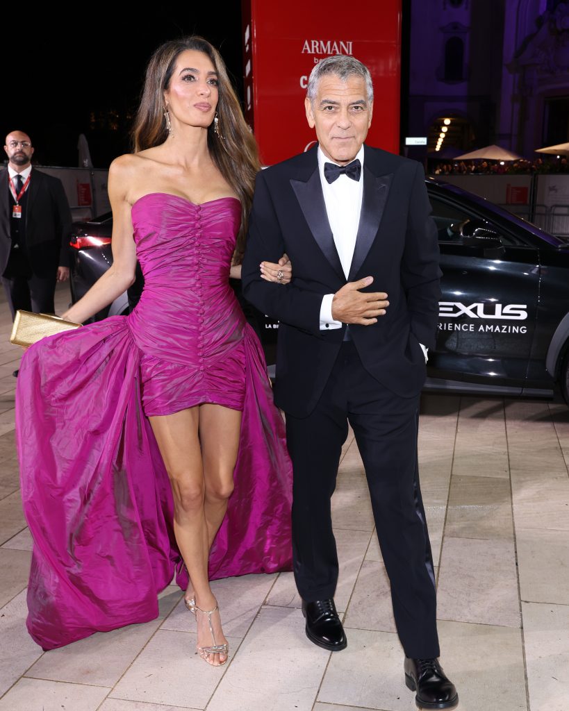 VENICE, ITALY - AUGUST 28: Amal Clooney and George Clooney attend the red carpet of the "Jay Kelly" screening during the 82nd Venice International Film Festival at Palazzo del Cinema on August 28, 2025 in Venice, Italy. (Photo by Pascal Le Segretain/Getty Images for Lexus)