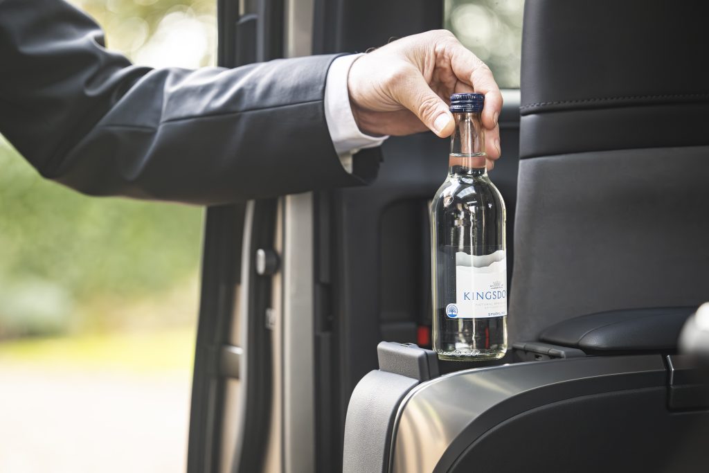 Chauffeur Rob Mitchelmore stocks the Lexus LM before the passengers arrive