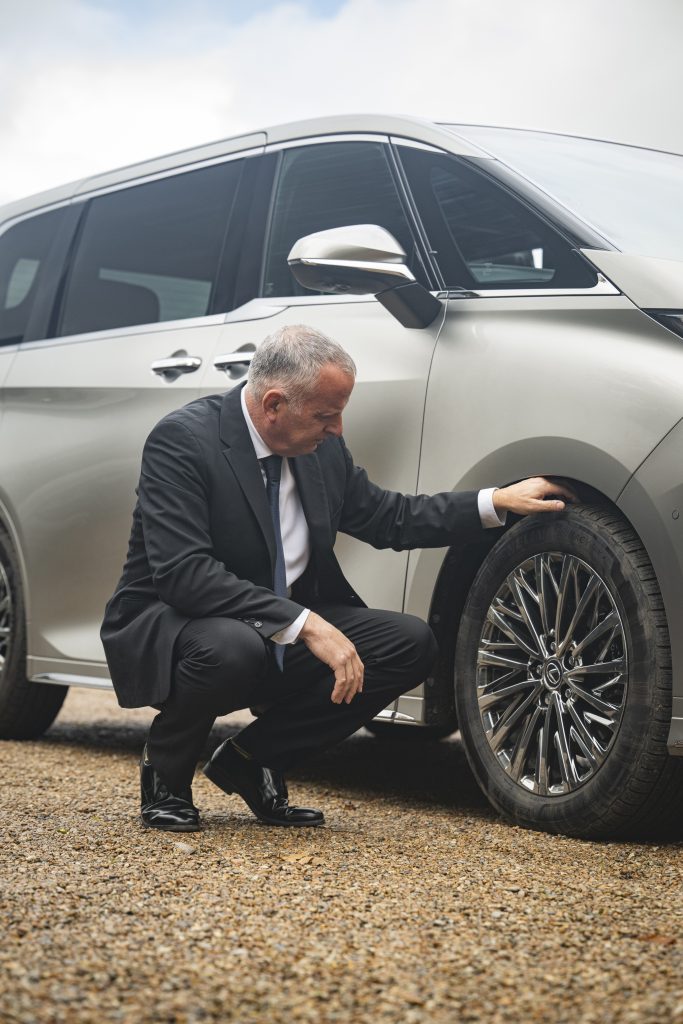 Chauffeur Rob Mitchelmore carries out pre-journey safety checks including checking the tyres for any wear and tear